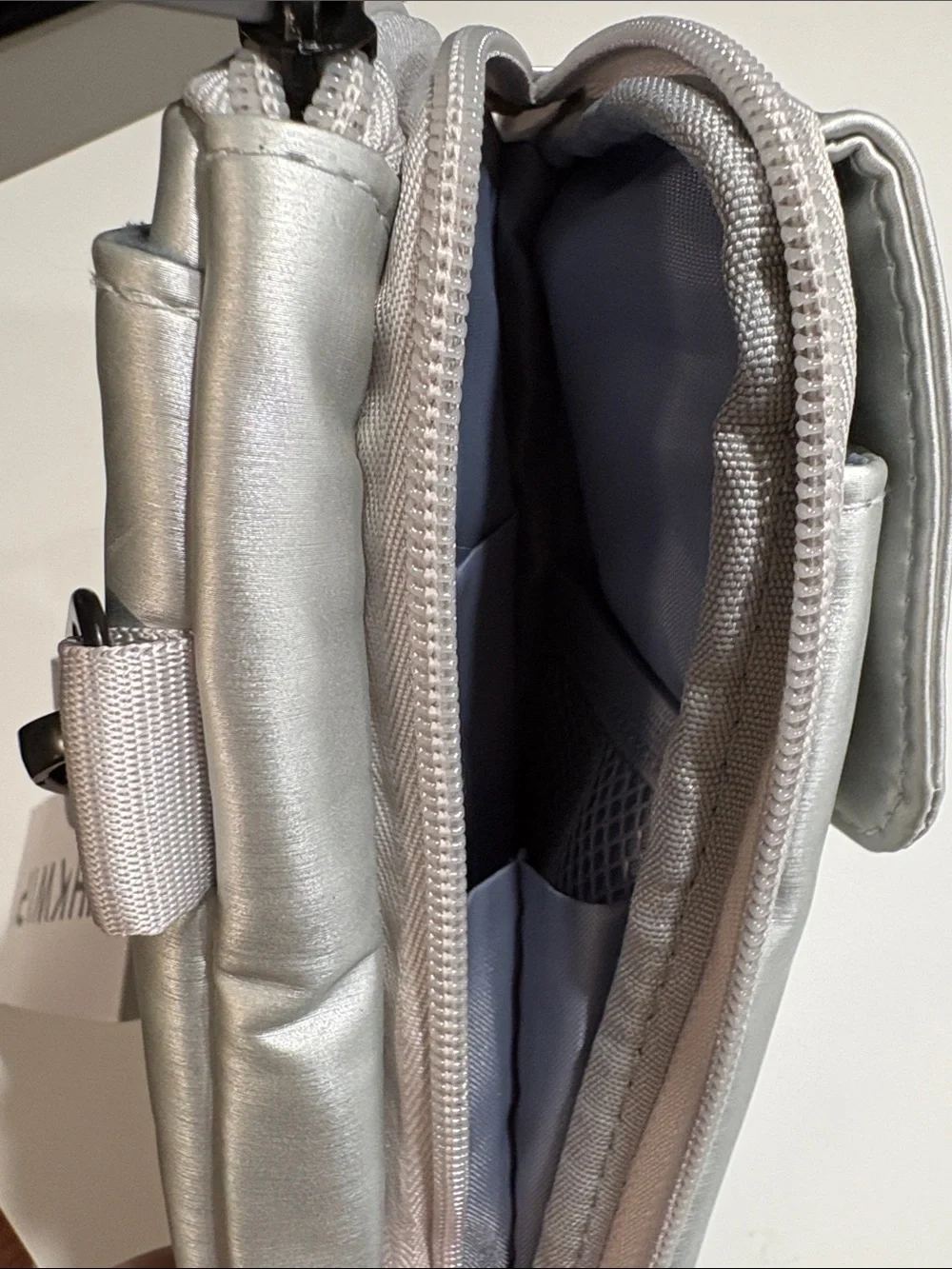 Ikwhip Metallic Matte Silver Everyday Crossbody Bag. Lots of pockets! Web strap